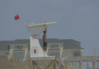 Summer celebrations meet closed beaches and warnings on US East Coast due to Hurricane Erin