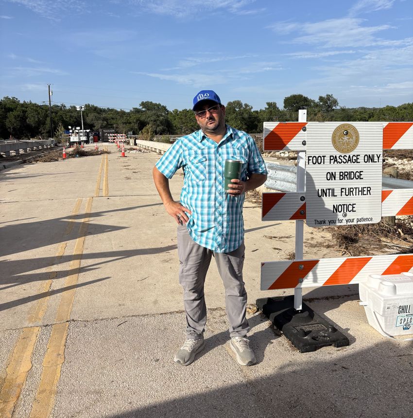 Abraham Stallins, on the flood-damaged bridge in Sandy Creek. The deck of the structure shifted several inches, isolating his community until a temporary crossing could be built.